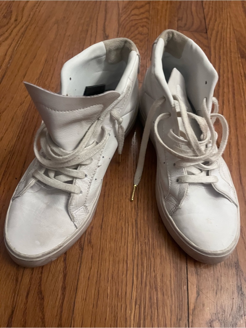 Well worn adidas White High-Top Leather Sneakers